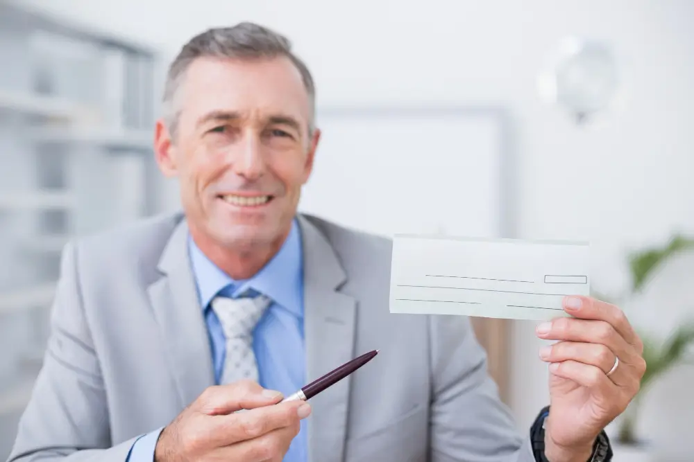 man showing business check formats